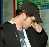 MORE PICS OF ROB ARRIVING AT LAX 5/5/10